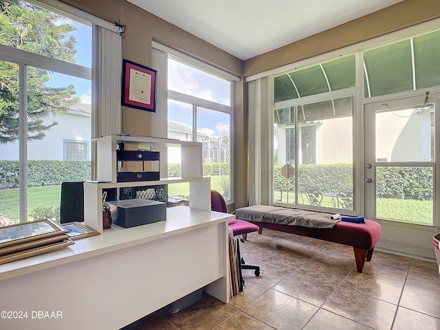 office with a wealth of natural light and tile patterned floors