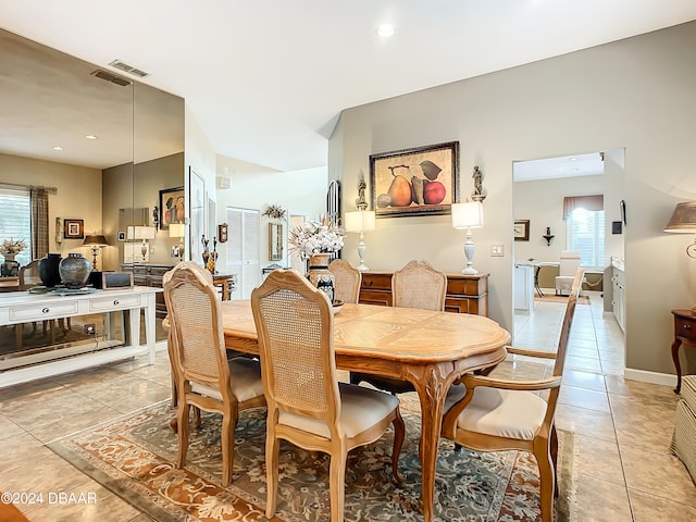 dining space featuring a healthy amount of sunlight and light tile patterned floors