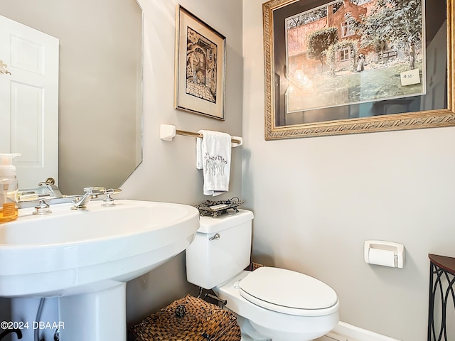 bathroom with toilet and sink