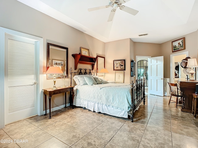 tiled bedroom with ceiling fan