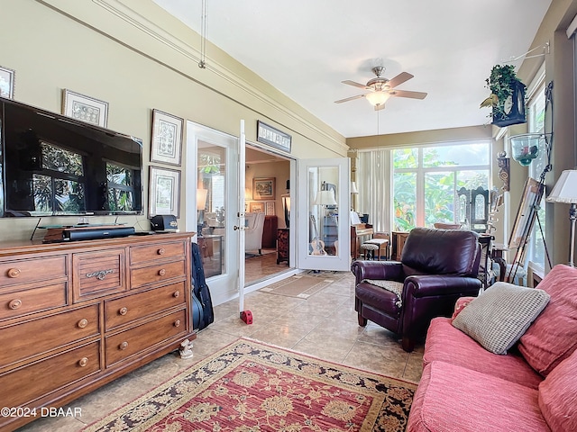 tiled living room featuring ceiling fan