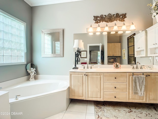 bathroom with a bath, vanity, tile patterned floors, and ornamental molding