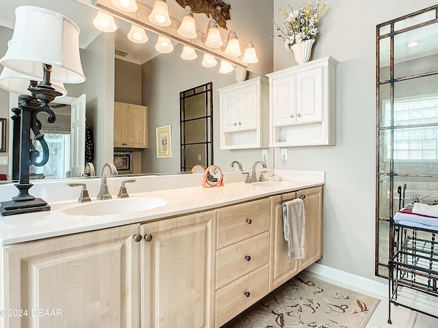 bathroom featuring vanity, tile patterned flooring, and crown molding