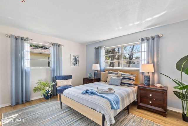 bedroom with light hardwood / wood-style floors