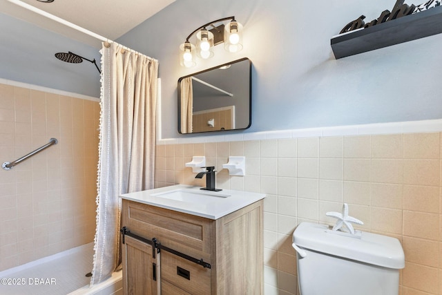 bathroom with vanity, tile walls, a shower with shower curtain, and toilet