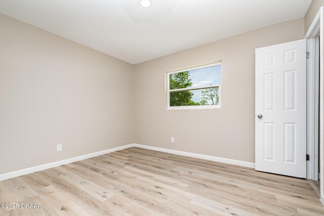 1808 Green Pl, Ormond Beach, FL 32174 - empty room featuring baseboards and light wood-type flooring