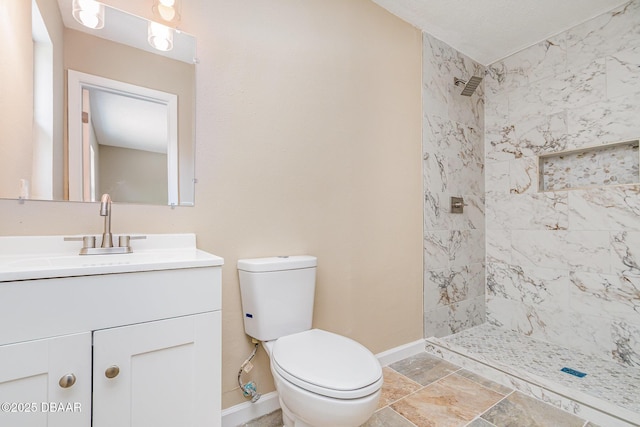 1808 Green Pl, Ormond Beach, FL 32174 - bathroom with baseboards, a tile shower, vanity, and toilet
