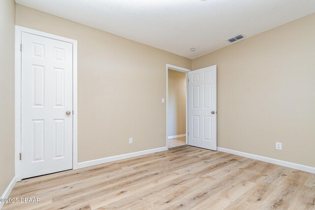 1808 Green Pl, Ormond Beach, FL 32174 - empty room with wood finished floors and baseboards