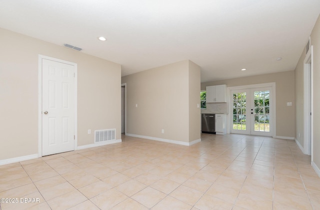 1808 Green Pl, Ormond Beach, FL 32174 - unfurnished living room featuring recessed lighting, baseboards, light tile patterned floors, and french doors