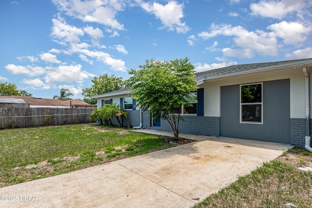 1808 Green Pl, Ormond Beach, FL 32174 - back of property with brick siding and a patio area