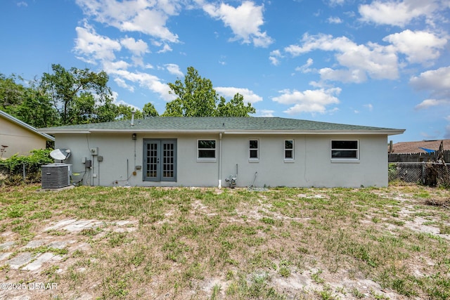 1808 Green Pl, Ormond Beach, FL 32174 - rear view of property featuring french doors, stucco siding, and central air condition unit
