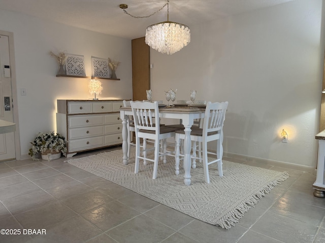 1415 Ocean Shore Blvd Unit 907, Ormond Beach, FL 32176 - dining space with tile patterned floors and a notable chandelier