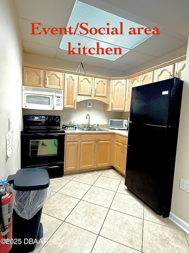 1415 Ocean Shore Blvd Unit 907, Ormond Beach, FL 32176 - kitchen with a paneled ceiling, a sink, light tile patterned floors, black appliances, and light brown cabinets