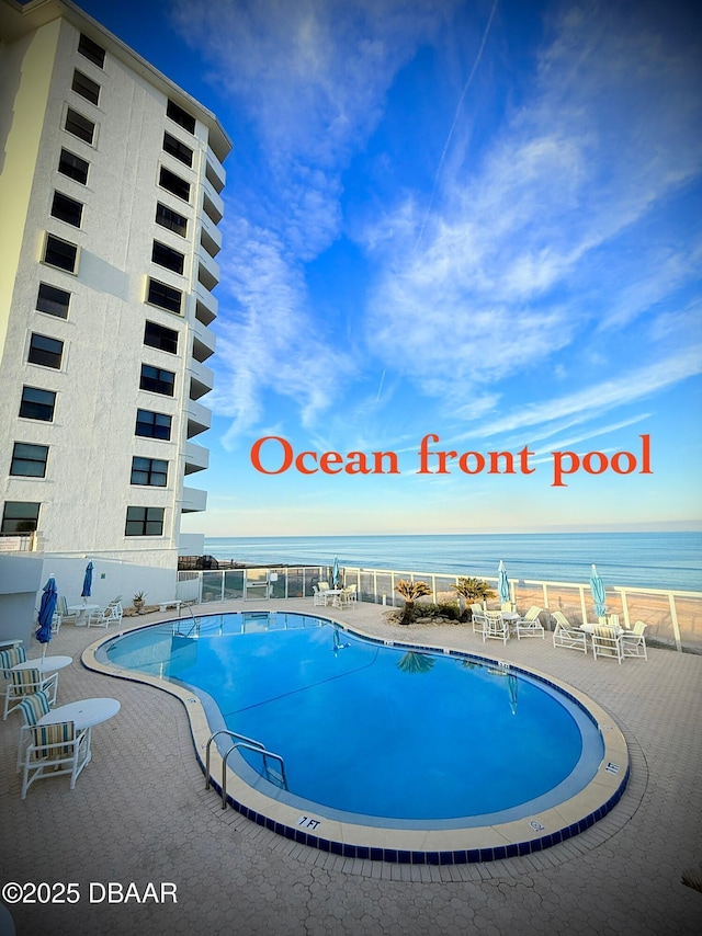 1415 Ocean Shore Blvd Unit 907, Ormond Beach, FL 32176 - pool featuring a water view