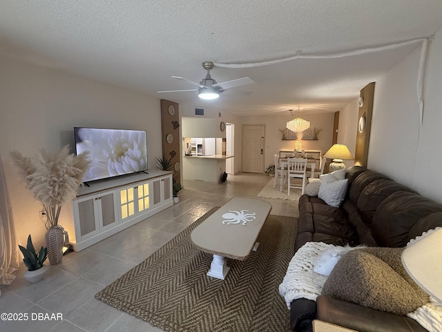 1415 Ocean Shore Blvd Unit 907, Ormond Beach, FL 32176 - tiled living room with a ceiling fan, a textured ceiling, and visible vents