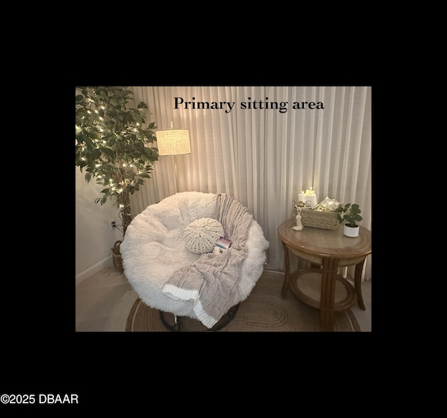 1415 Ocean Shore Blvd Unit 907, Ormond Beach, FL 32176 - sitting room featuring baseboards