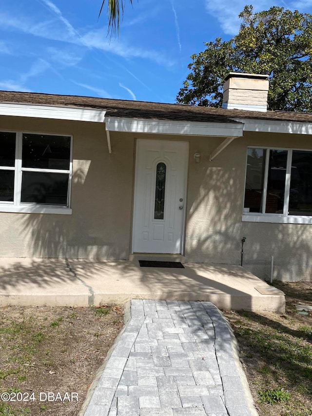 doorway to property with a porch