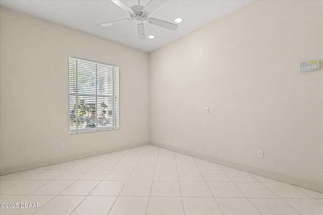 spare room featuring ceiling fan, recessed lighting, and baseboards