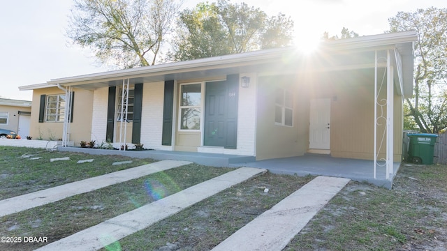 single story home with brick siding