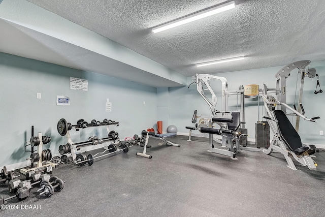 gym with a textured ceiling