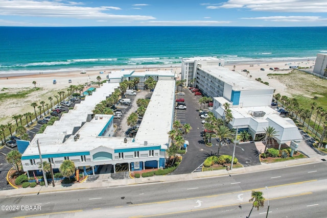 birds eye view of property featuring a view of the beach and a water view