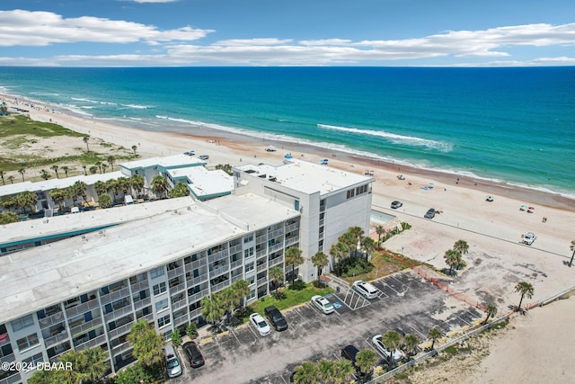 birds eye view of property with a view of the beach and a water view