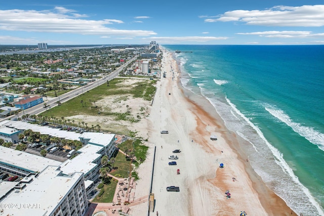 aerial view featuring a view of the beach and a water view