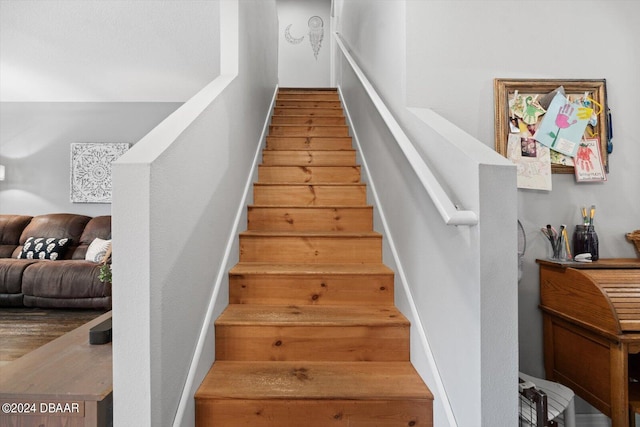 stairway featuring hardwood / wood-style flooring