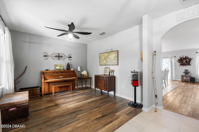 misc room featuring wood-type flooring and ceiling fan