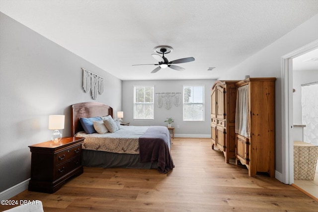 bedroom with light hardwood / wood-style flooring and ceiling fan