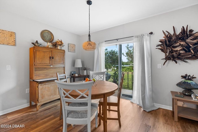 dining area with dark hardwood / wood-style floors