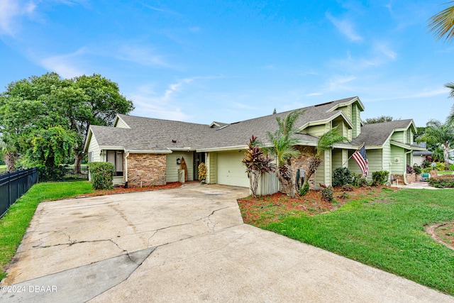 ranch-style home featuring a garage and a front yard