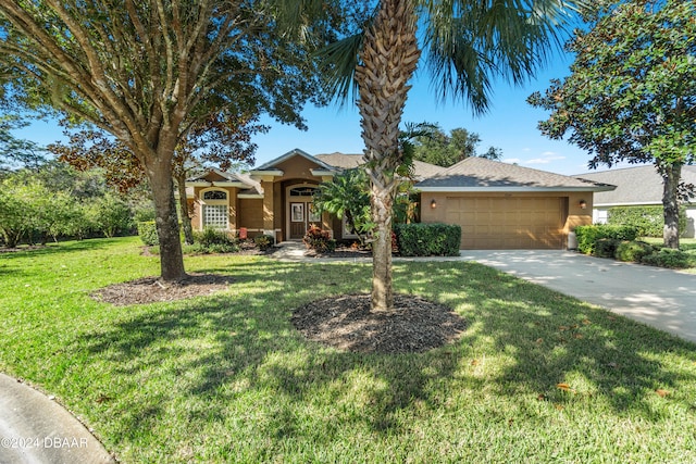 view of front facade featuring a front yard and a garage