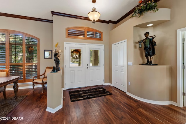 entryway featuring dark hardwood / wood-style floors, ornamental molding, and french doors