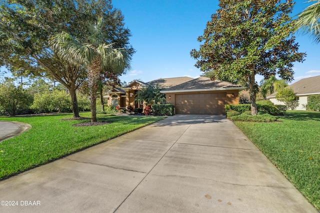 view of front facade featuring a front yard and a garage