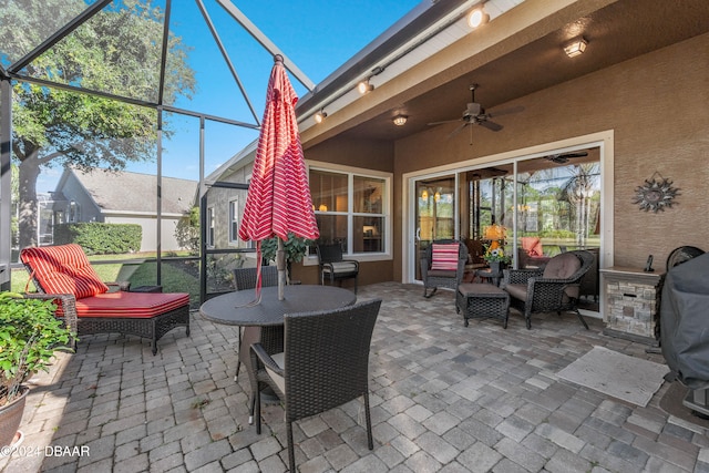 view of patio with outdoor lounge area and ceiling fan