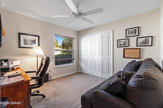 carpeted office with ceiling fan