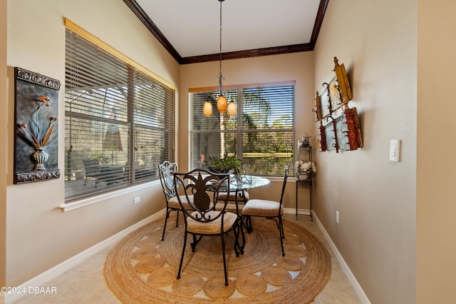 dining area featuring light tile patterned flooring, ornamental molding, and a notable chandelier