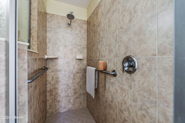 bathroom with a tile shower