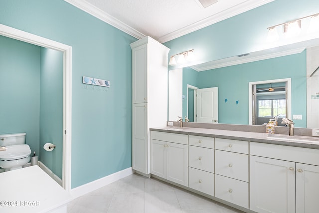 bathroom featuring ornamental molding, vanity, tile patterned floors, and toilet