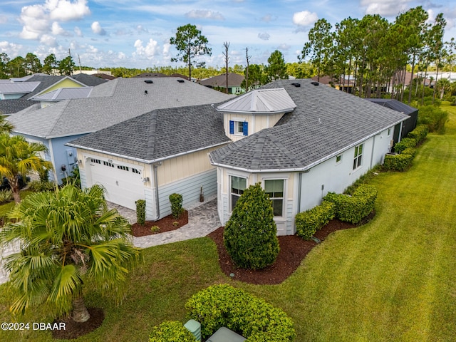 view of front of house with a garage and a front yard