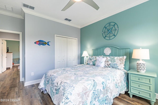 bedroom with dark hardwood / wood-style floors, ornamental molding, and a closet