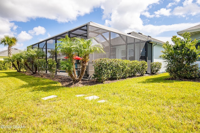 view of property exterior featuring a lawn and glass enclosure