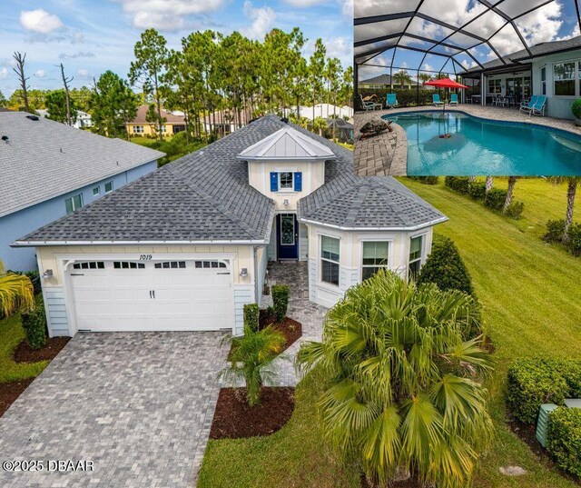 view of front facade with a garage and a front yard