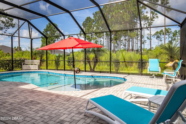 view of pool featuring a lanai and a patio area