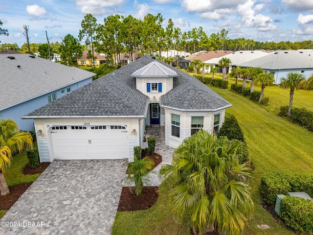 view of front facade with a garage and a front yard