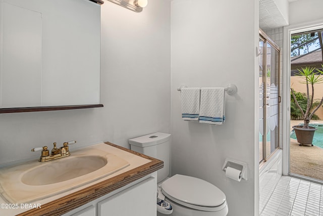 129 Sand Fiddler Ct, Daytona Beach, FL 32119 - bathroom featuring toilet, vanity, and tile patterned floors