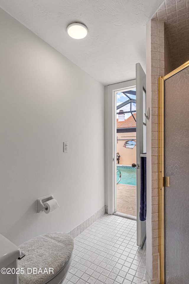 129 Sand Fiddler Ct, Daytona Beach, FL 32119 - bathroom with tile patterned flooring and an enclosed shower