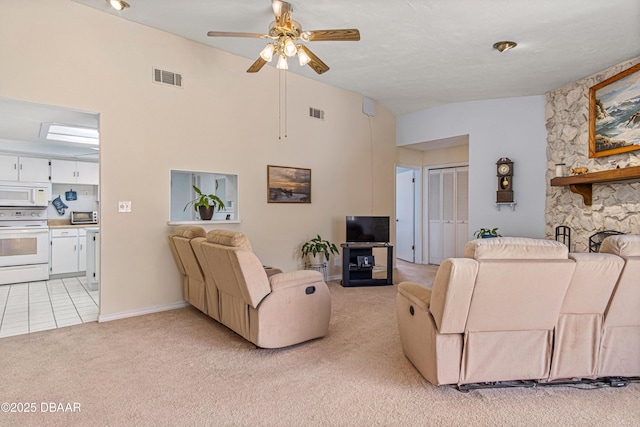 129 Sand Fiddler Ct, Daytona Beach, FL 32119 - living area featuring light colored carpet, lofted ceiling, and ceiling fan