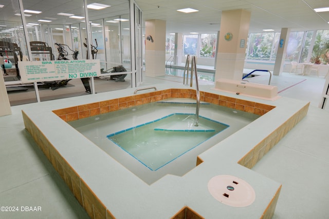 view of pool with an indoor in ground hot tub